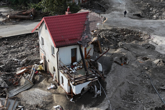 Scenes of devastation after the flood. A photo of a house destroyed by te flood. 